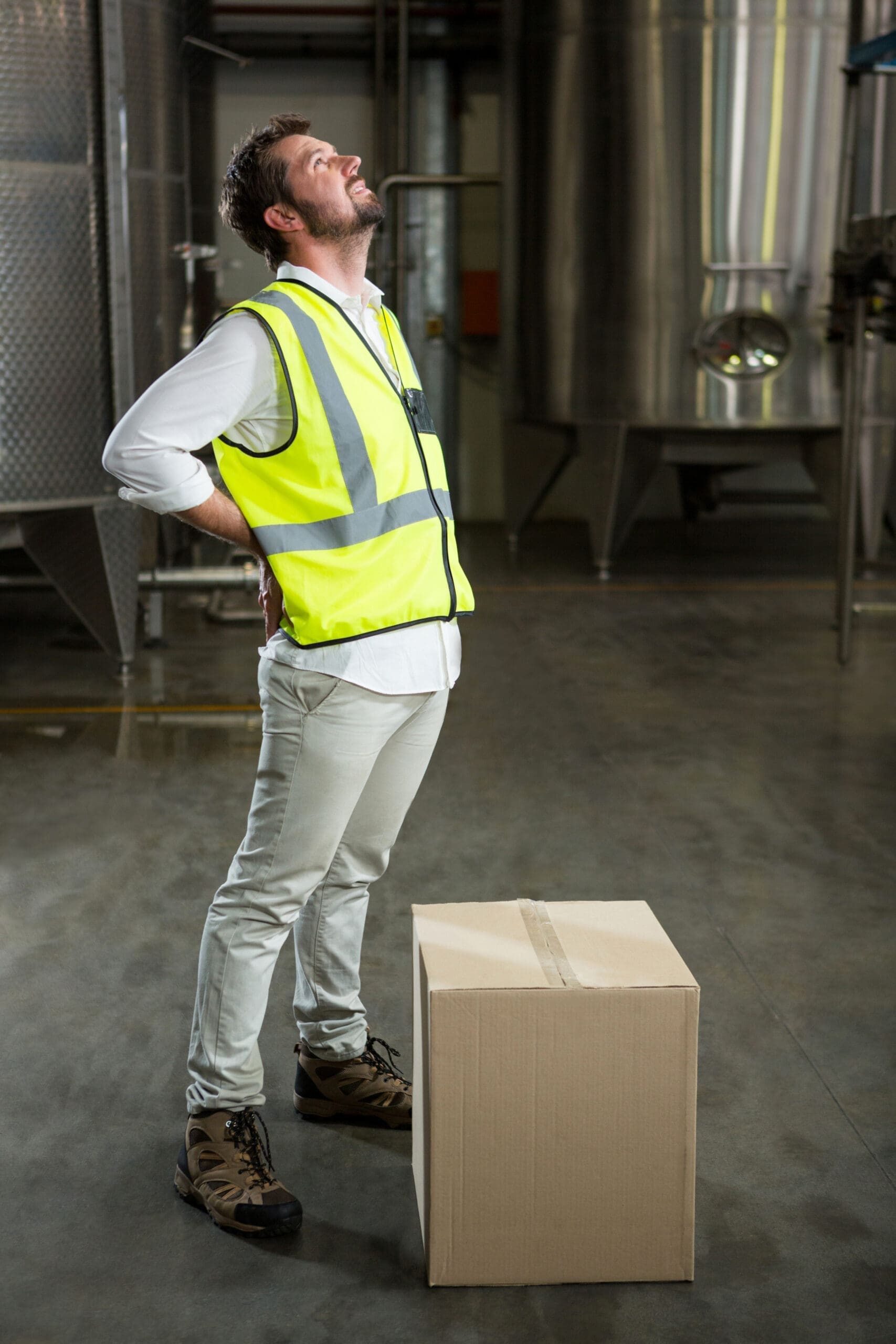 Man with aching back due to poor manual handling